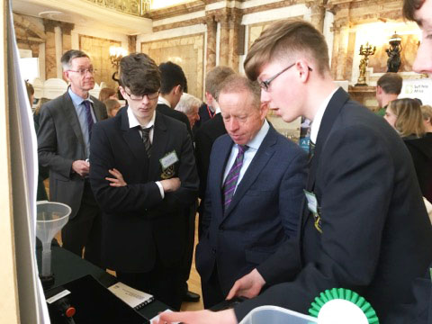 Students from Moate Community School discuss their project with Minister Ciarán Cannon