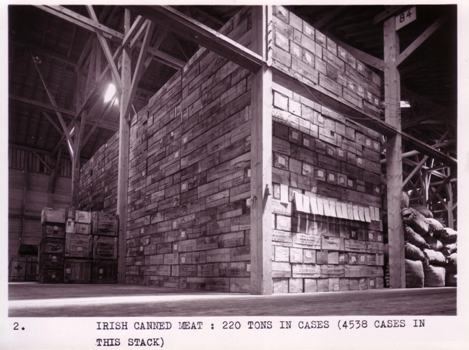 Canned meat awaits dispatch from Ireland to assist those affected by World War II. 